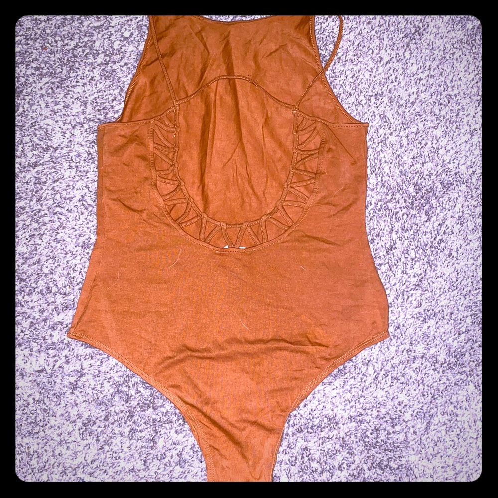 Brown body suit with intricate back